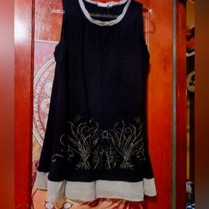 Elegant Black and Tan Sleeveless Tank Logo